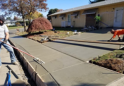 Leupitz contractors at work laying new driveway and sidewalk