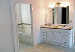 Bathroom remodel with matching white bathtub and sink