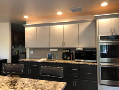 Kitchen remodel with black and grey cabinetry