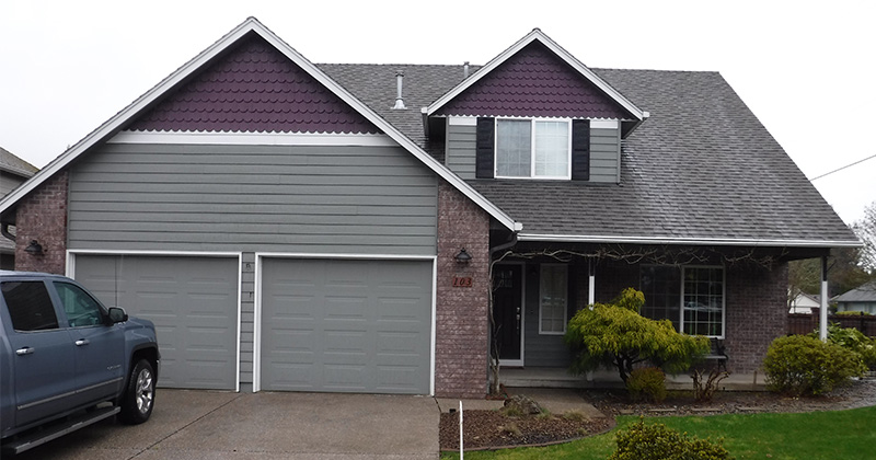 grayish house with purple accents and white trim exterior completed by leupitz contractors