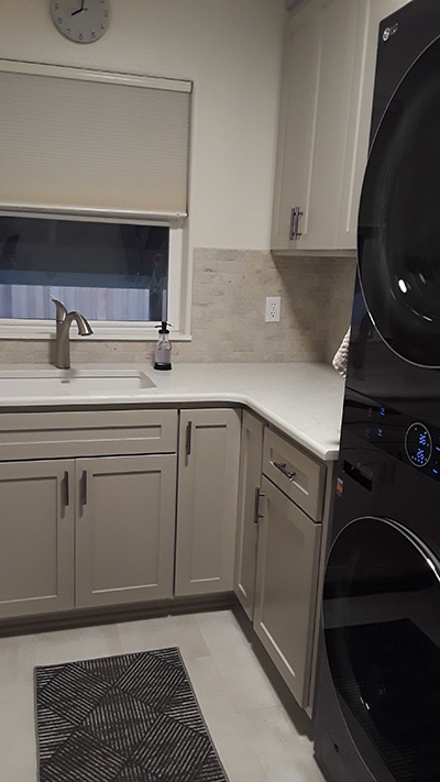 Laundry machines and cabinetry with sink