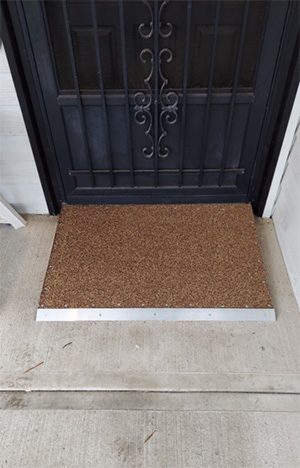 Added lip to door mat for accessibility