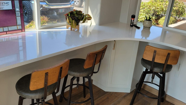 White counter with bar stools
